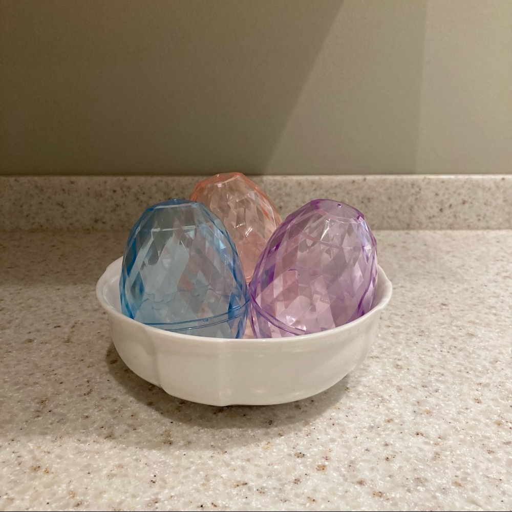 Three pastel plastic Easter eggs.